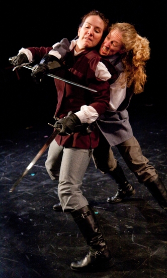 Macbeth (Kathrynne Wolf) defends herself from Macduff (Amy E. Harmon) Photo